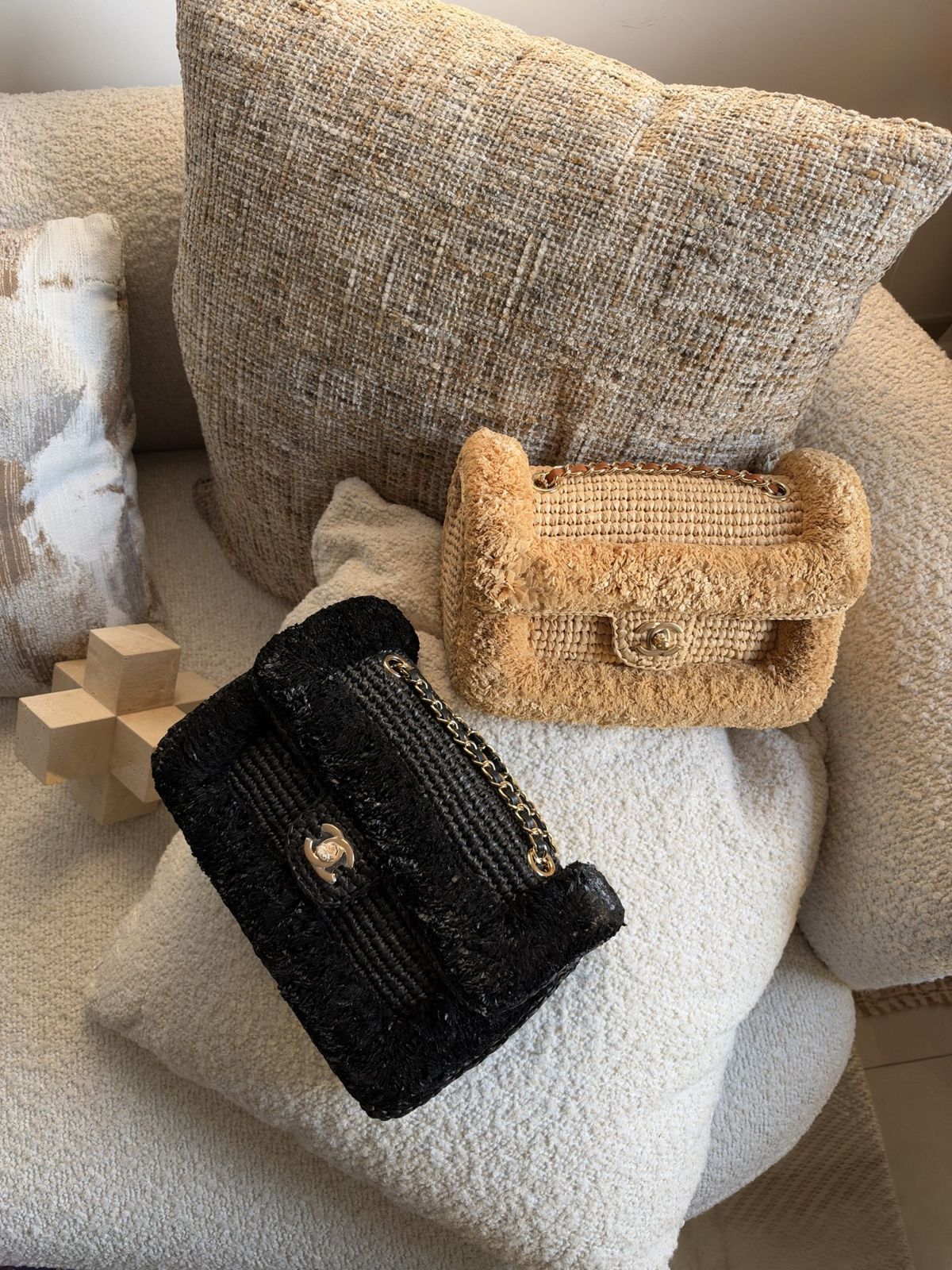 Camel and black shearling and raffia flap bags